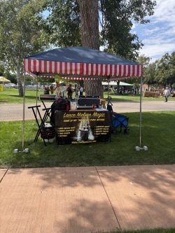 Fillmore Utah Arts Festival Sept. 2025 booth set up for Magic and Balloons.