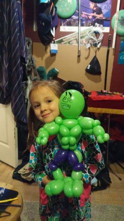 Cutest girl with Mr. Muscle's balloon figure.